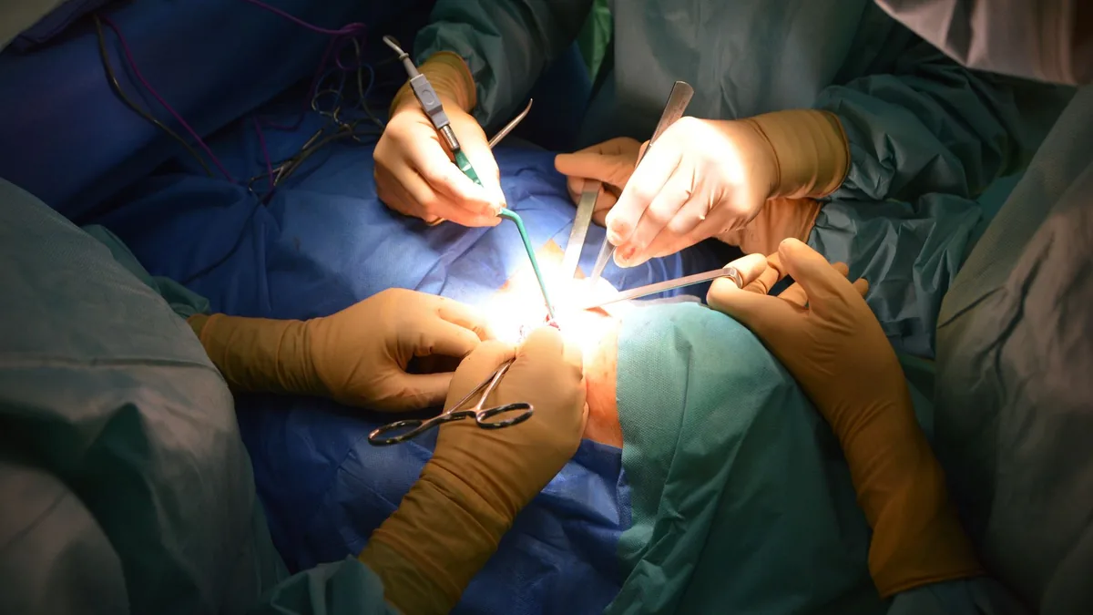 Close-up view of surgeons in an operating room performing a surgery with precision. — Illustration for a report on GLP-1 gastroparesis and aspiration risk after semaglutide cessation
