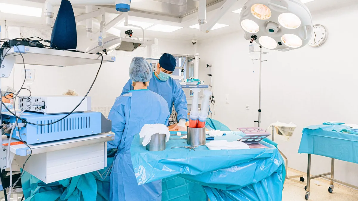Close-up view of surgeons in an operating room performing a surgery with precision. — Illustration for a report on GLP-1 gastroparesis and aspiration risk after semaglutide cessation