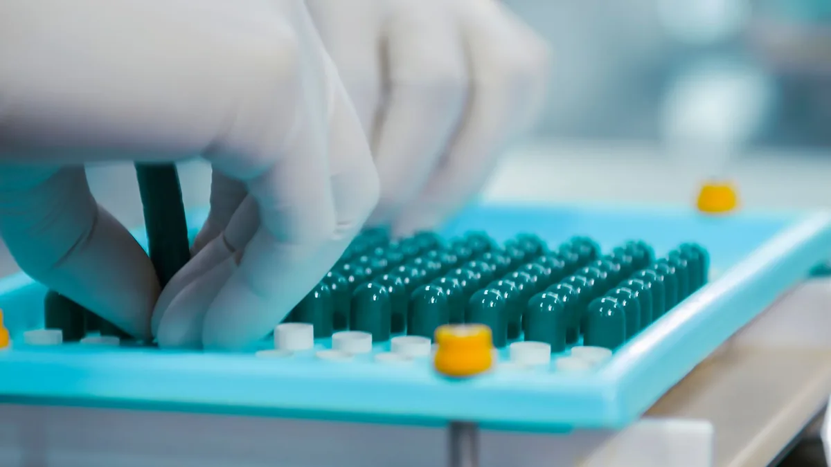 Vials arranged in a lab rack, showcasing scientific organization and research preparation. — Illustration accompanying a report on synthetic semaglutide reporting gaps raised in a Diabetes, Obesity & Metabolism letter